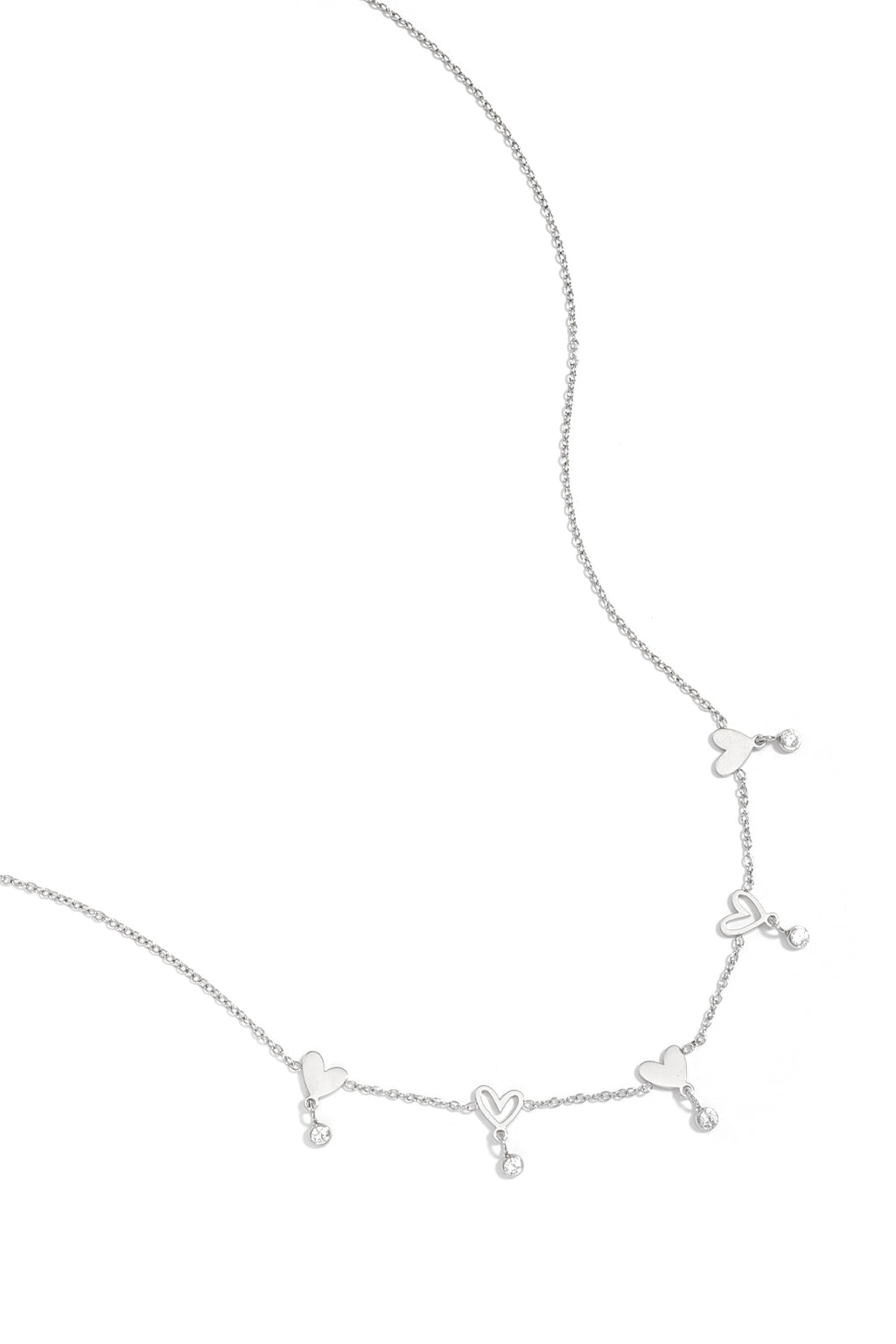 Ketting met wisselende hartjes en hangende steentjes