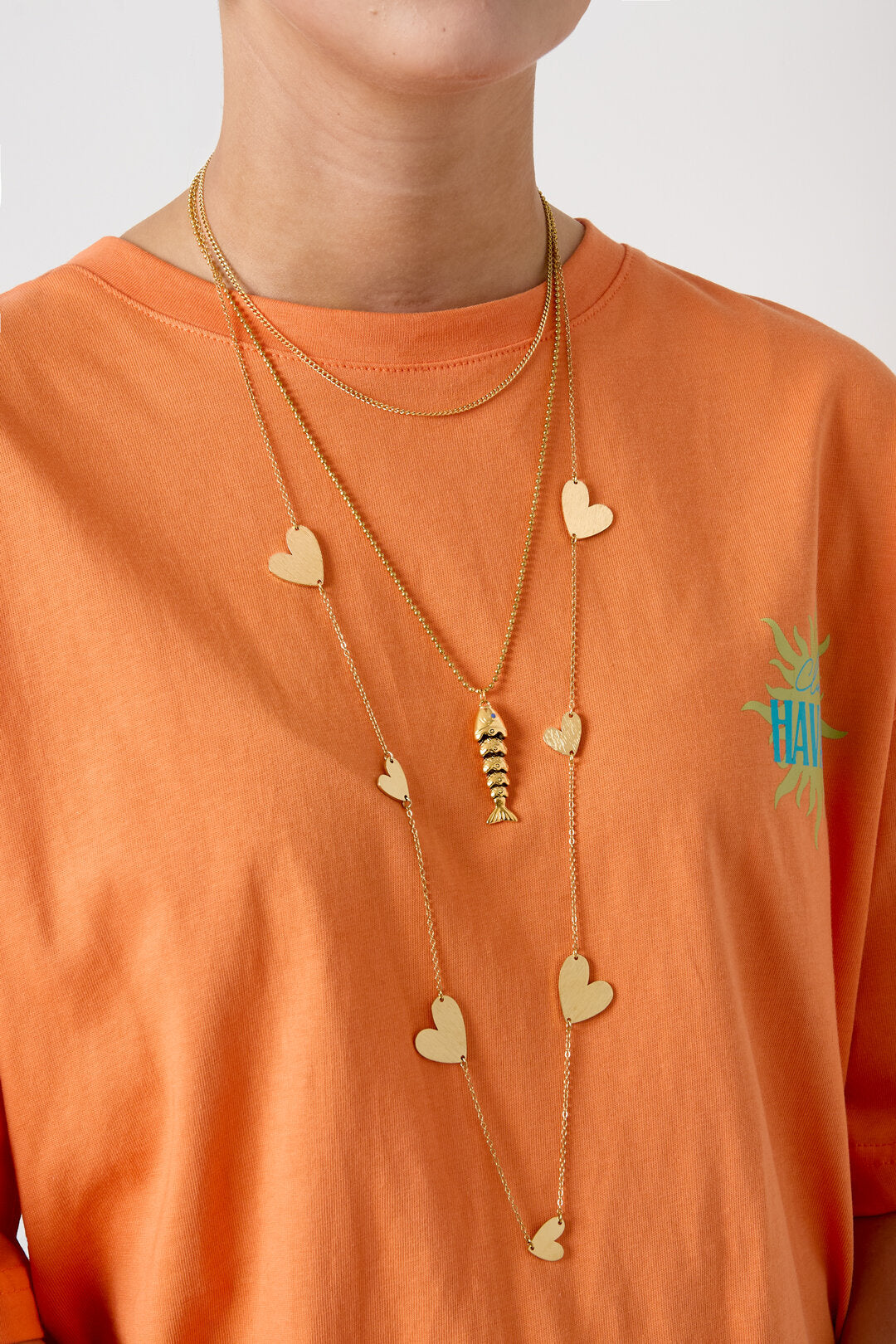 Lange ketting met hartjes in verschillende maten