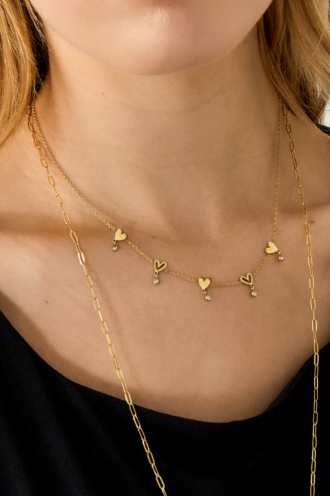 Ketting met wisselende hartjes en hangende steentjes
