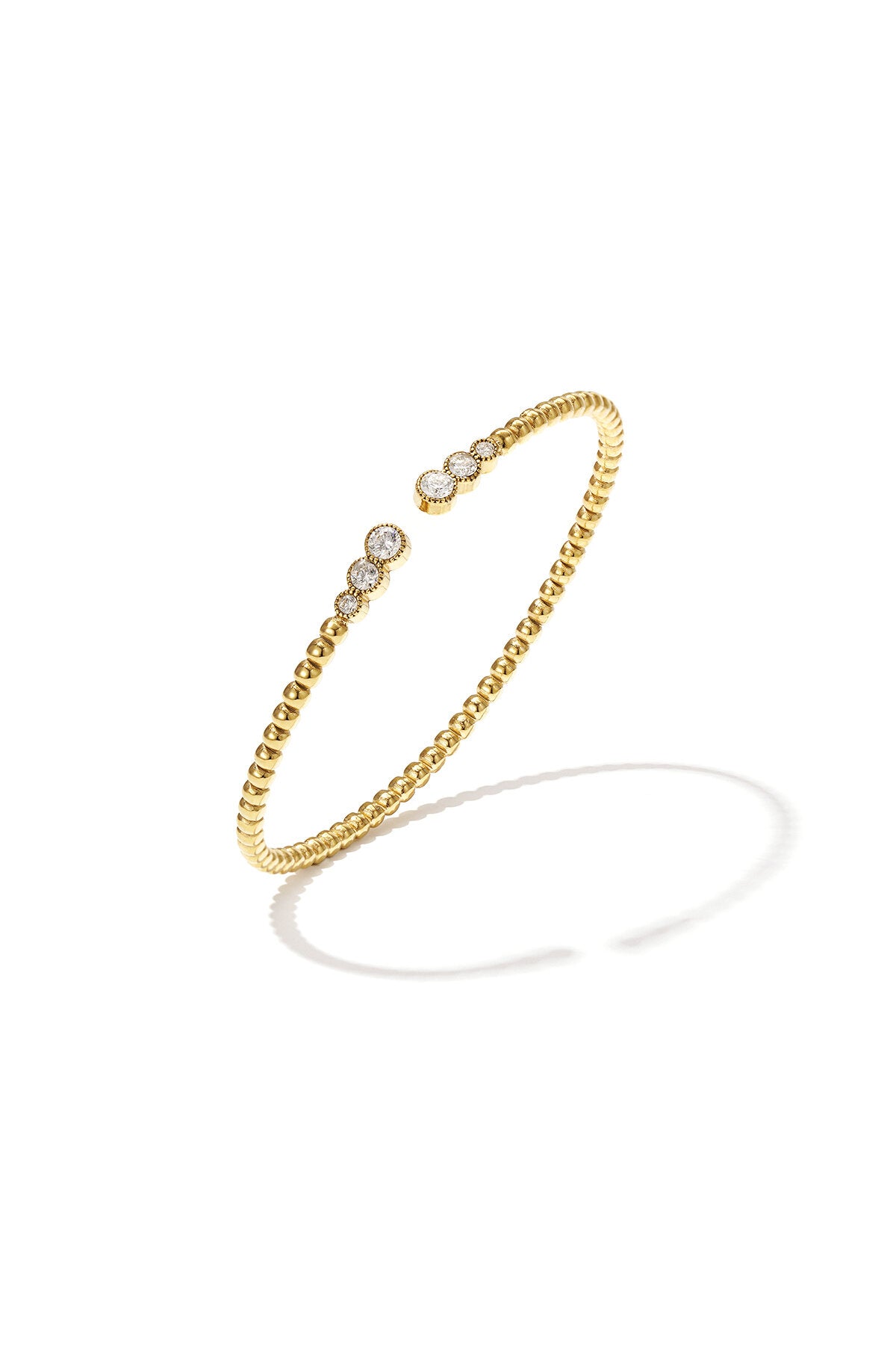 Symmetrisch gestipte bangle met gedetailleerde uiteinden