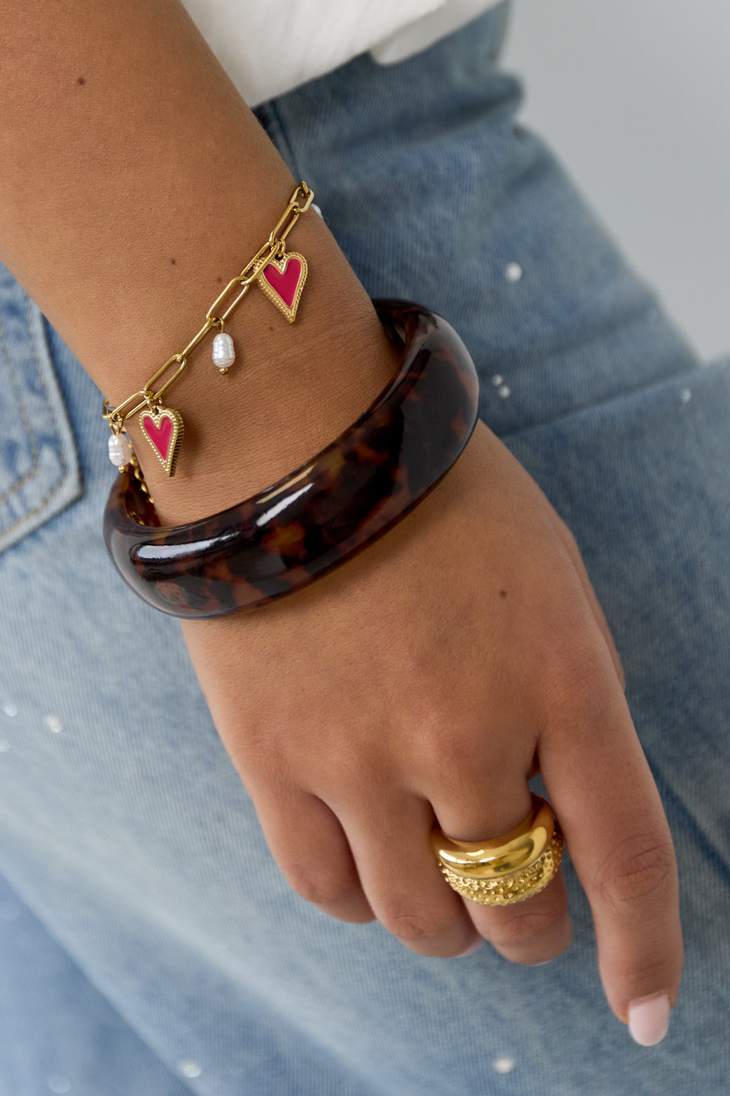 Schakel armband met parels en hart charms
