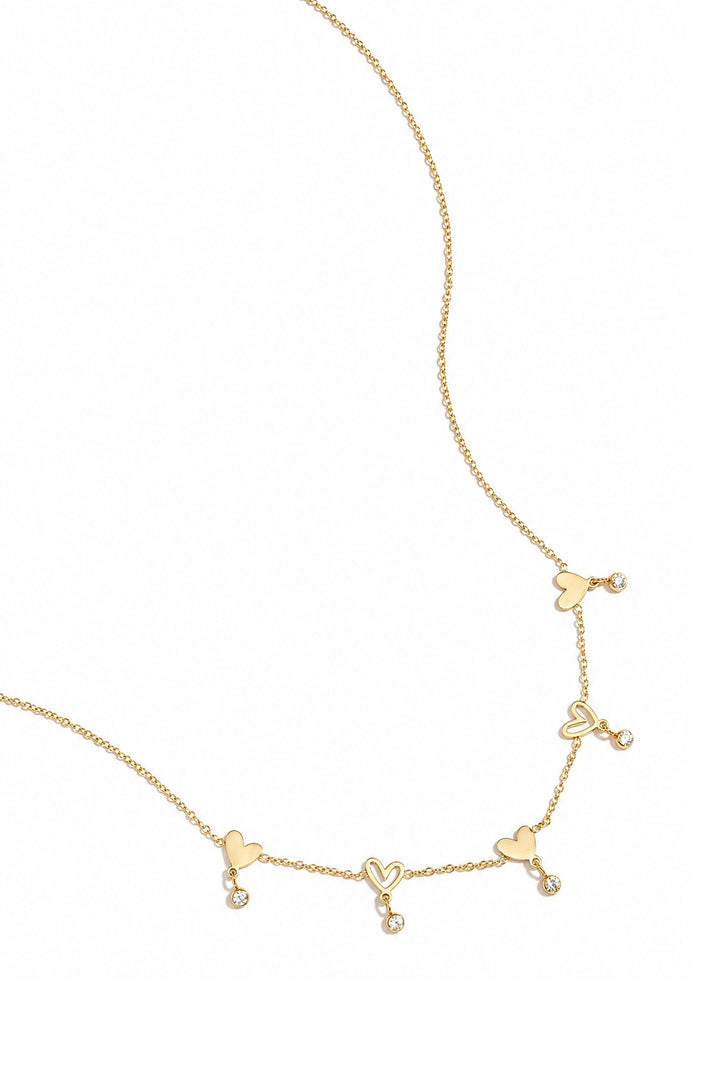 Ketting met wisselende hartjes en hangende steentjes